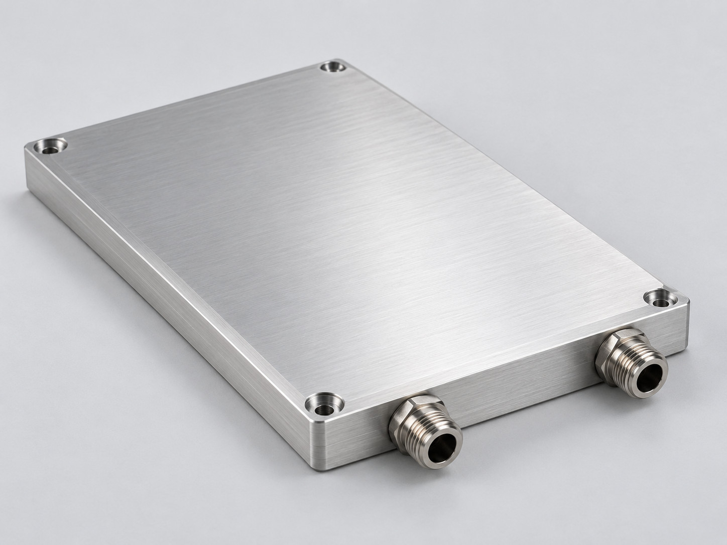 Closed machined aluminum liquid cold plate with two separate coolant fittings and perimeter mounting holes.