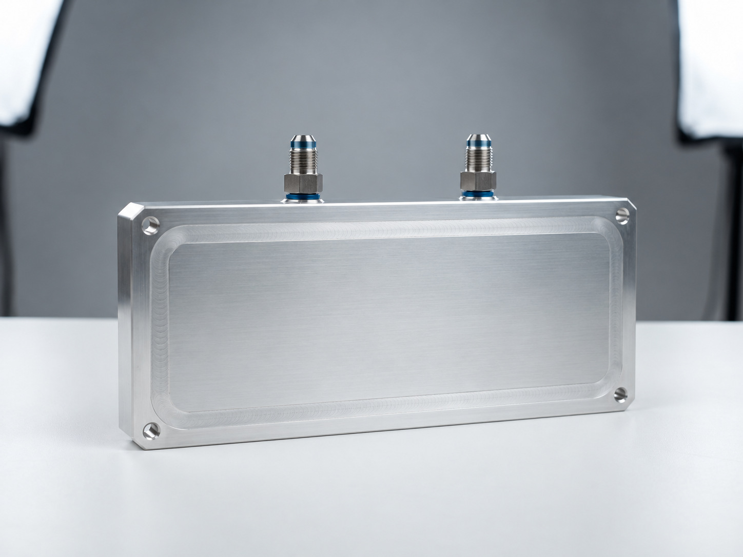 Aluminium friction stir welded liquid cold plate with clean flush perimeter weld seam and dual fluid connectors