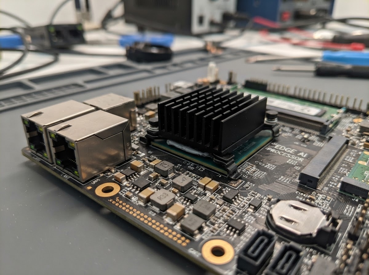 Industrial edge computing motherboard with compact heat sink cooling processing IC near dual Ethernet ports