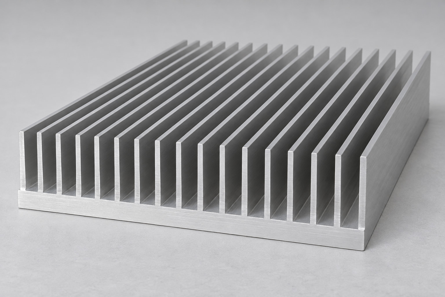 Silver aluminum extrusion with continuous parallel fins and an integral base