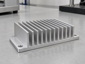 sandblasted aluminum heat sink finished part with straight fins and mounting ears