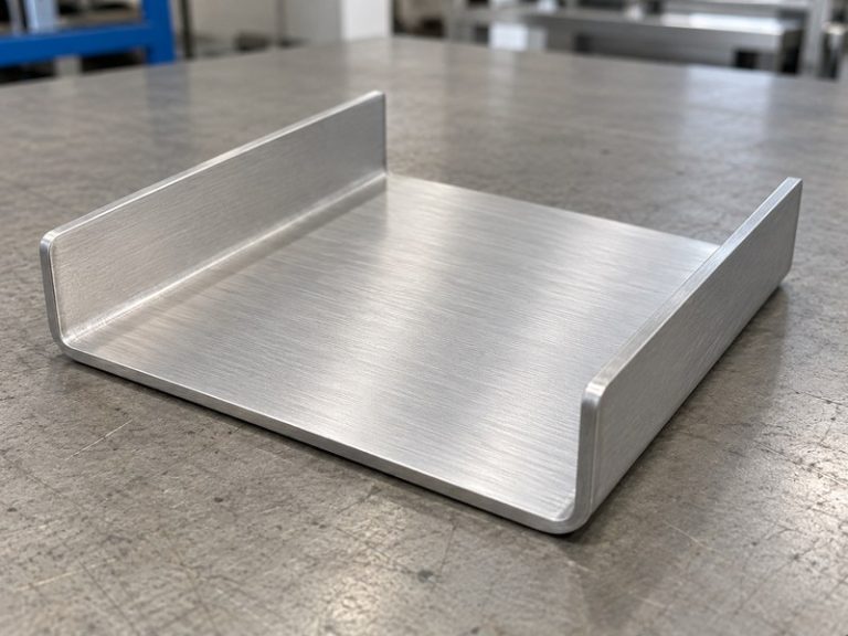 Sheet metal bending aluminum heat sink with a continuous base and two formed flanges