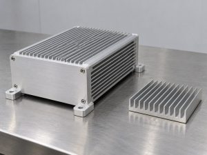 Structural radiator aluminum heat sink enclosure beside a separate finned cooling component